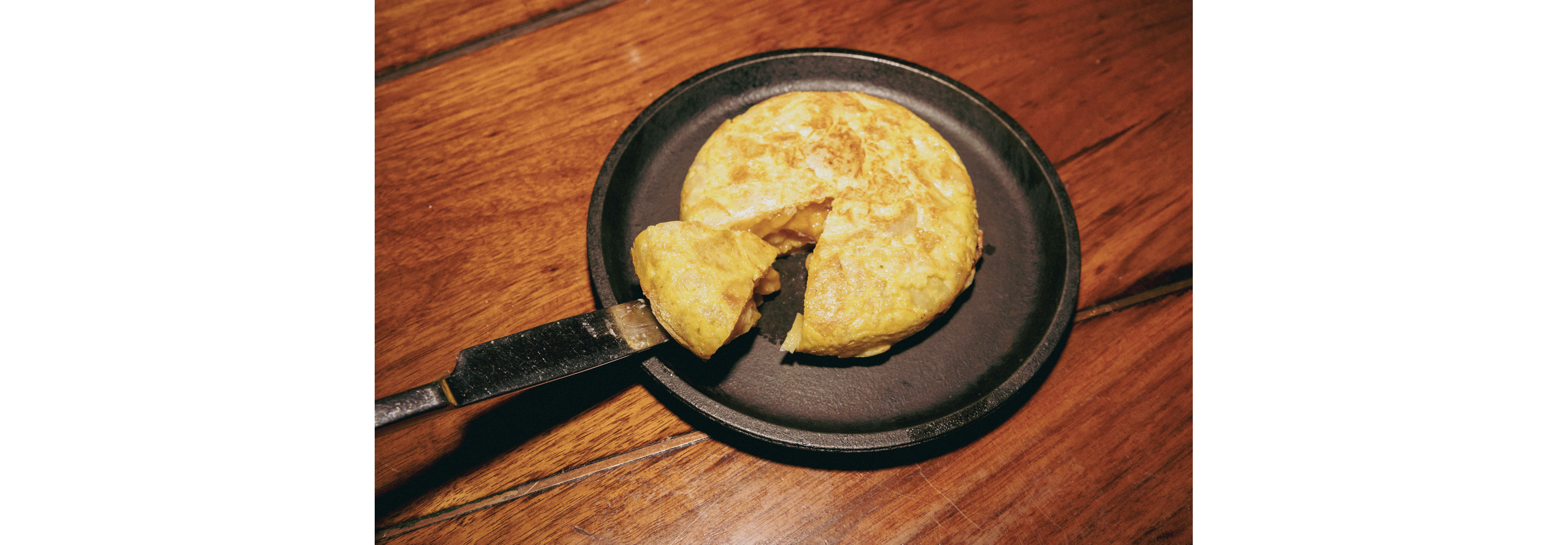 A Spanish dish on a cast iron skillet.