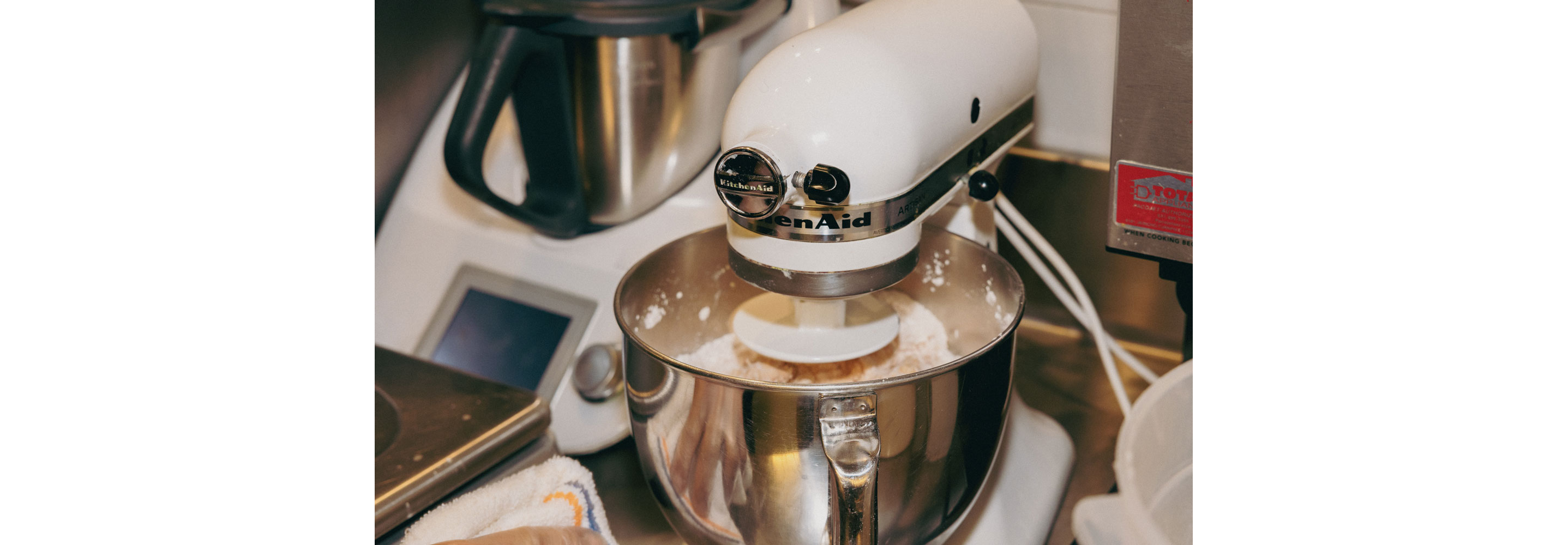 A stand mixer avidly mixing.