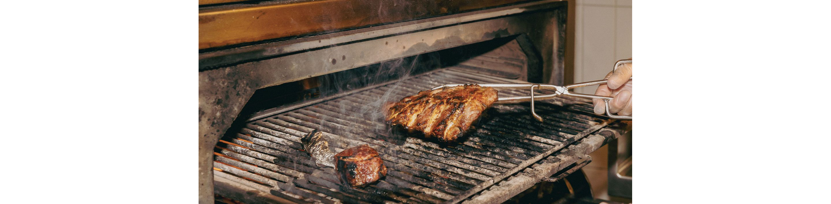 A piece of meat being grilled.