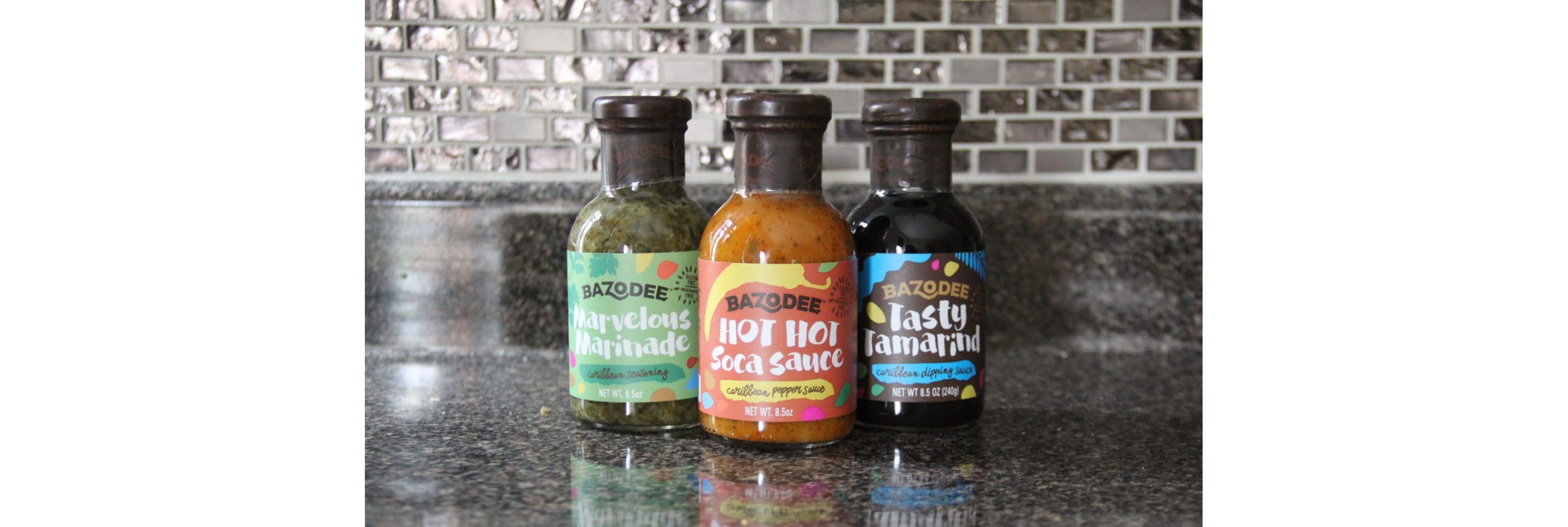 Three bottles of Bazodee sauces and marinades.