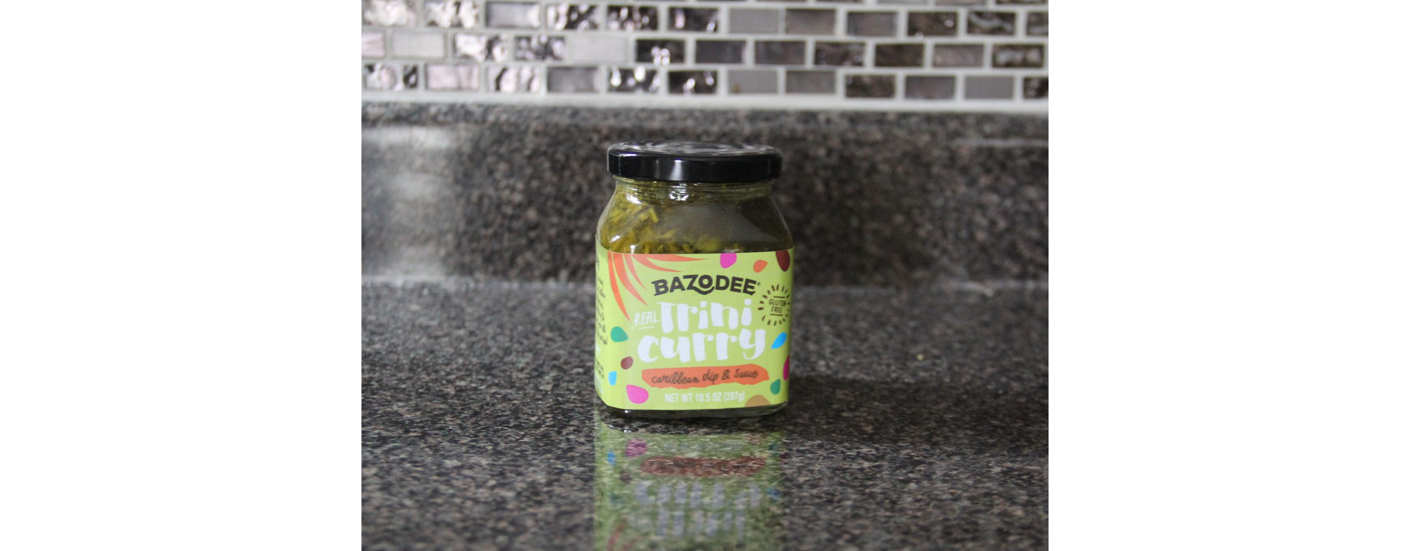 A full jar of Bazodee Caribbean dip and sauce.