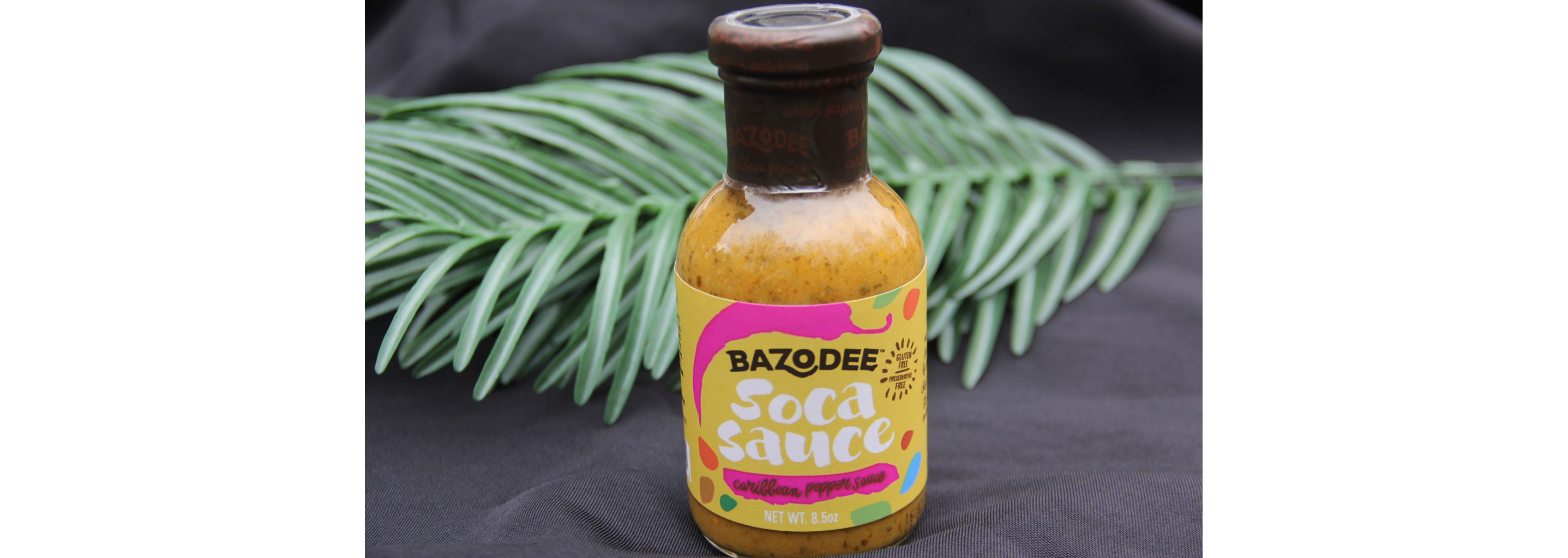A full bottle of Bazodee Caribbean pepper sauce.