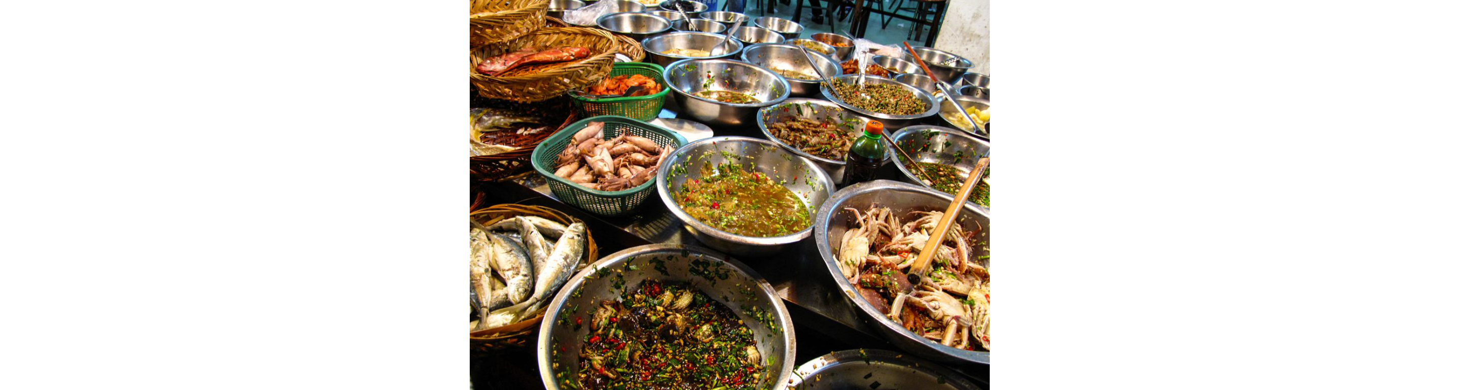 Stainless steel bowls filled with a variety of Teochew food.