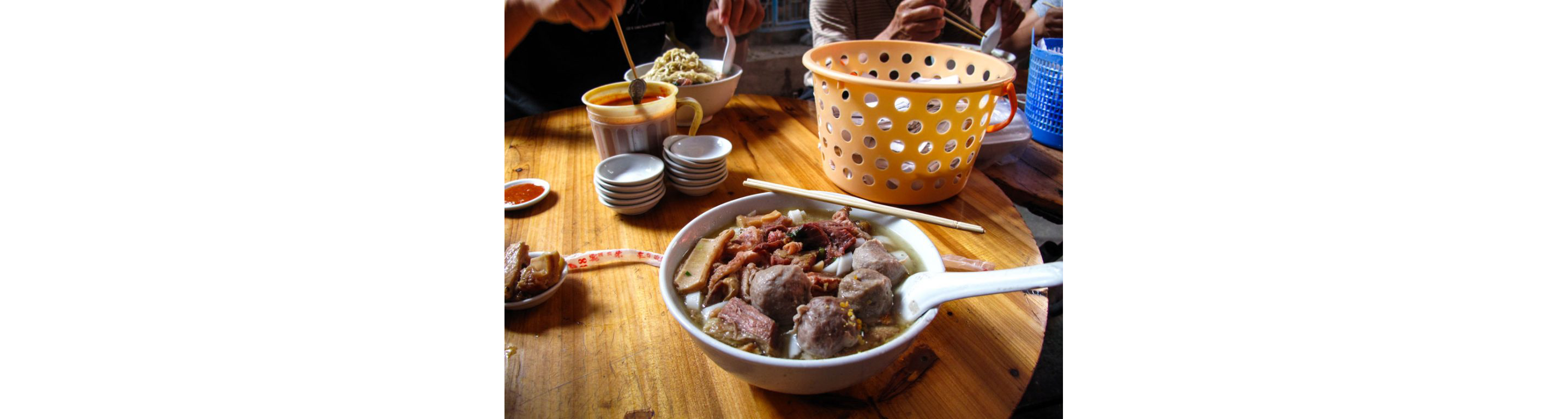 A bowl of soup on a table.