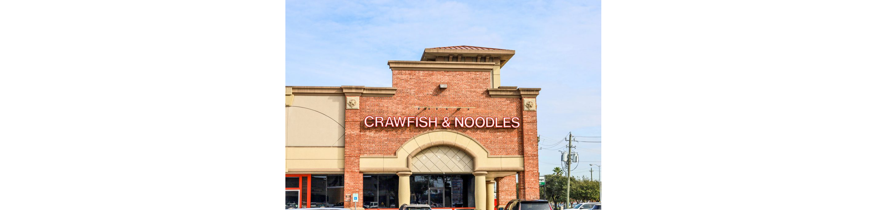 The exterior of Crawfish & Noodles.