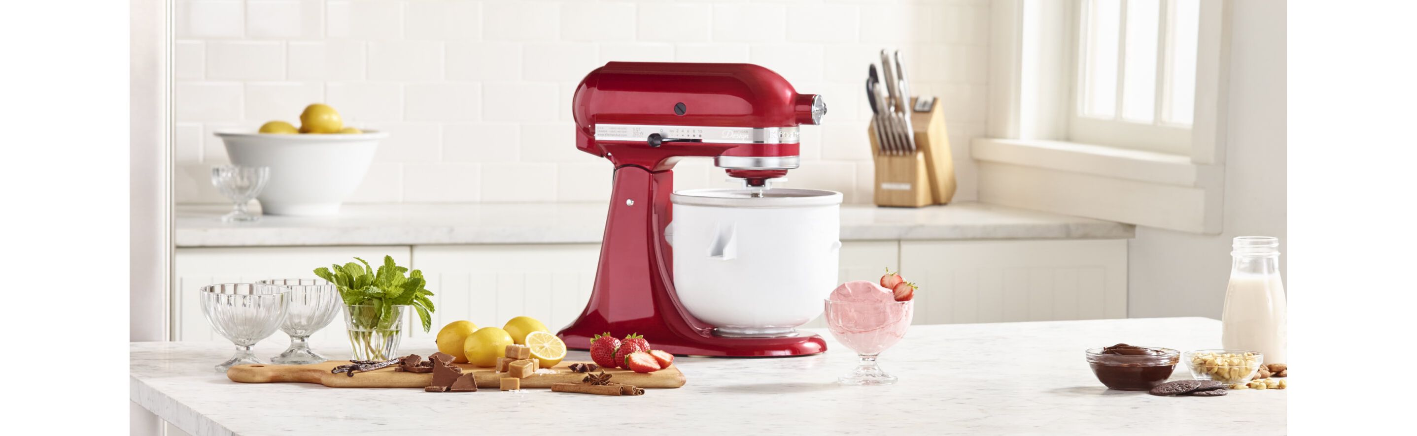 Ingredients for making homemade frozen yogurt in a KitchenAid® stand mixer.