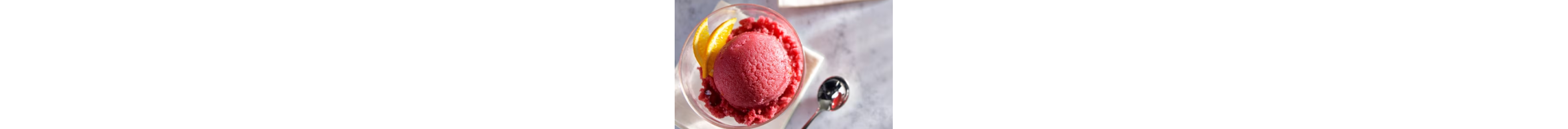 A bold pink sorbet in a glass bowl.