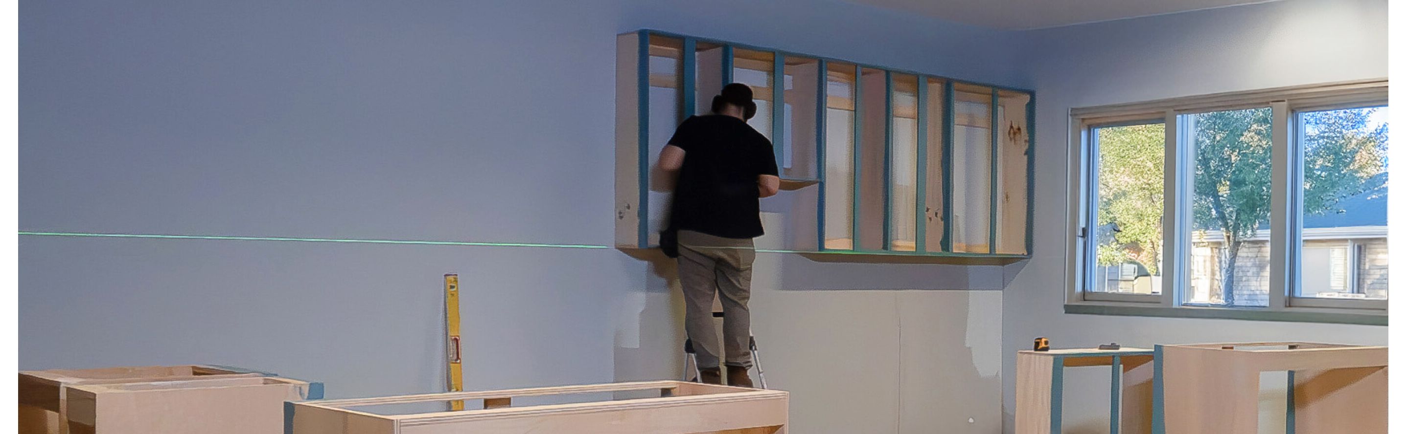 Person installing cabinetry