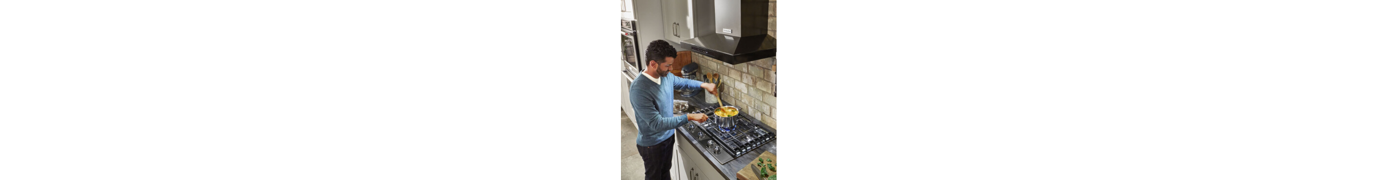 Person cooking on a gas cooktop