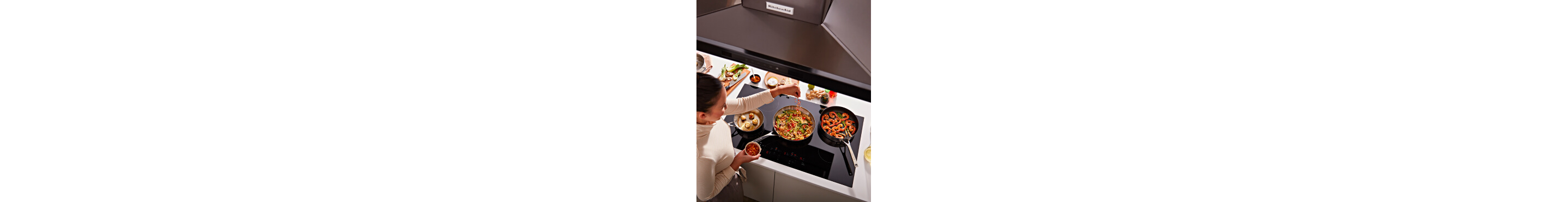 Person cooking on an electric cooktop