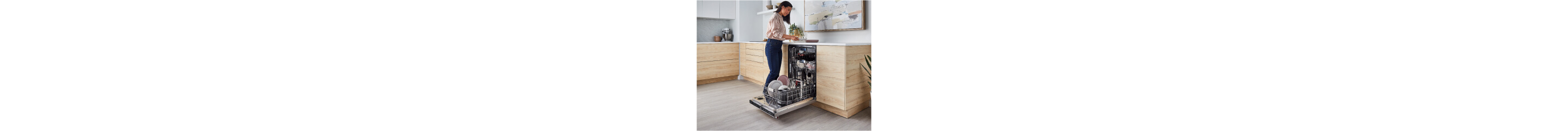 Person loading dishes into a dishwasher