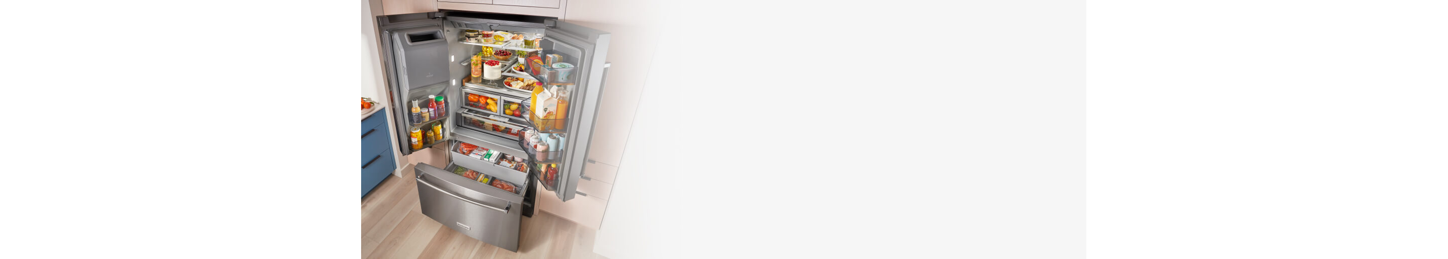 Open French door refrigerator filled with groceries