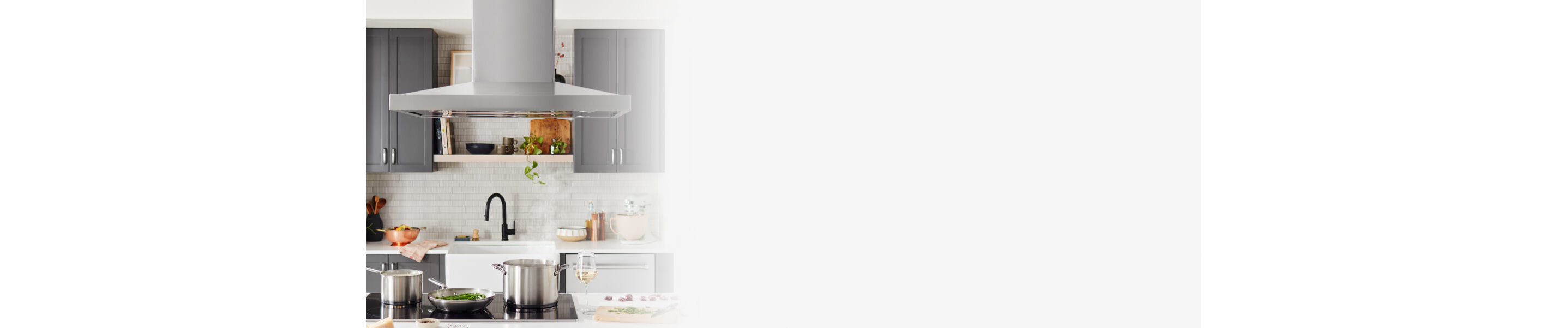Island-mount kitchen hood in a bright kitchen