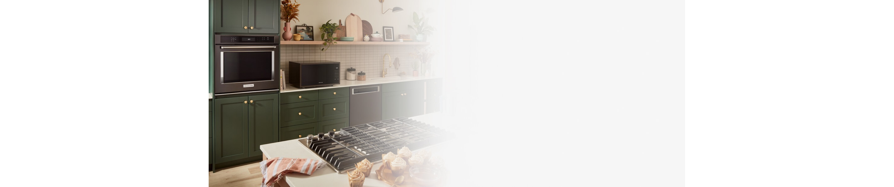 KitchenAid® major appliances in a green kitchen
