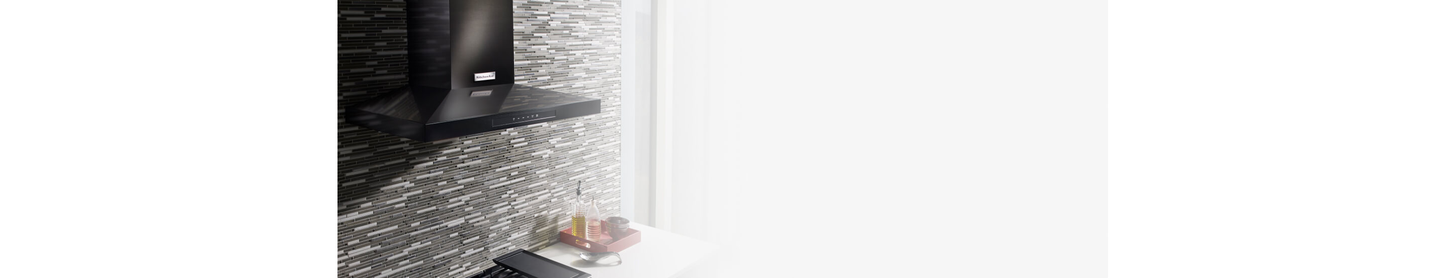 Wall-mount range hood in a contemporary kitchen
