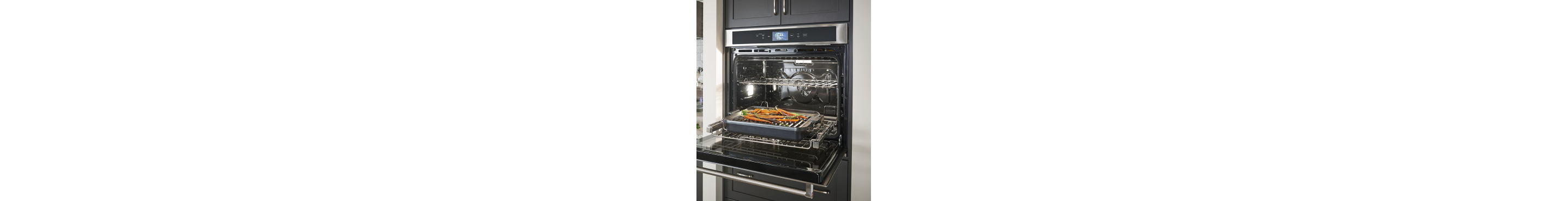 Wall oven open with food in it