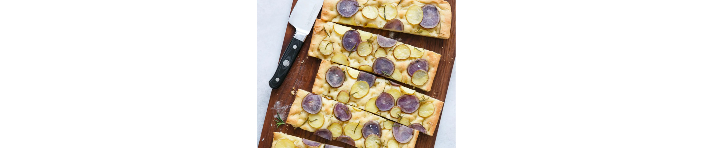 Potato focaccia on cutting board 