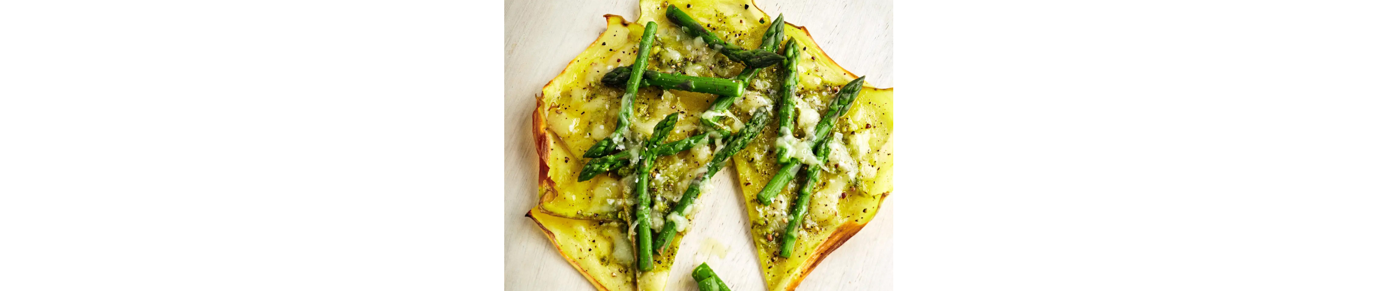 Potato crust pizza topped with asparagus