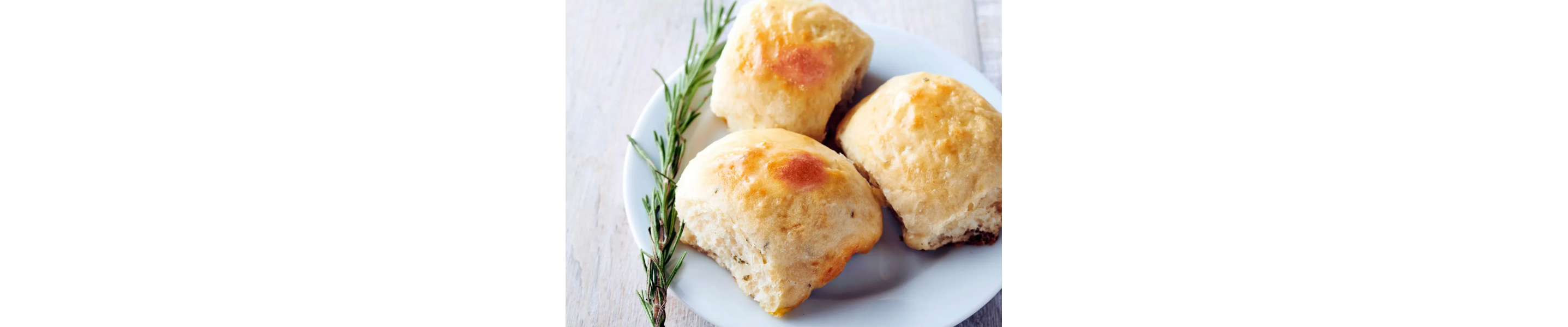 Potato rolls with sprig of rosemary 