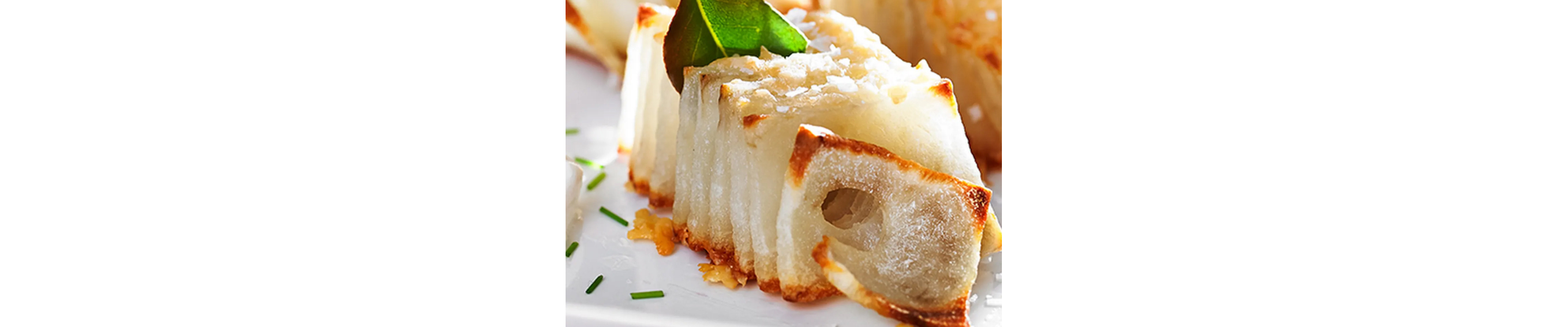 Domino potatoes on white plate