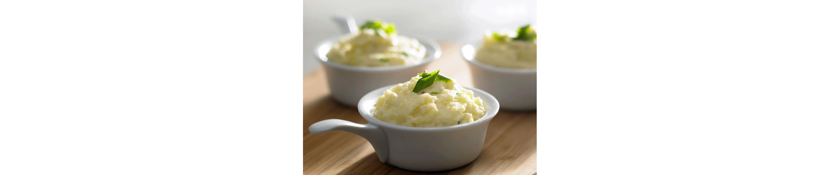 Mashed potatoes in white ramekins 