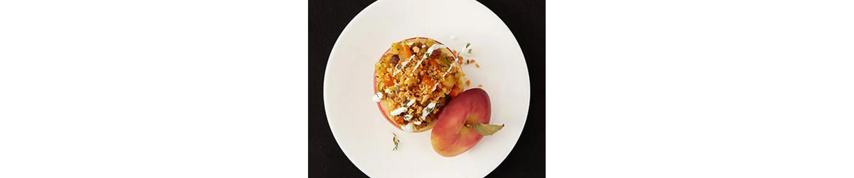 Sweet potato stuffed apple on white plate