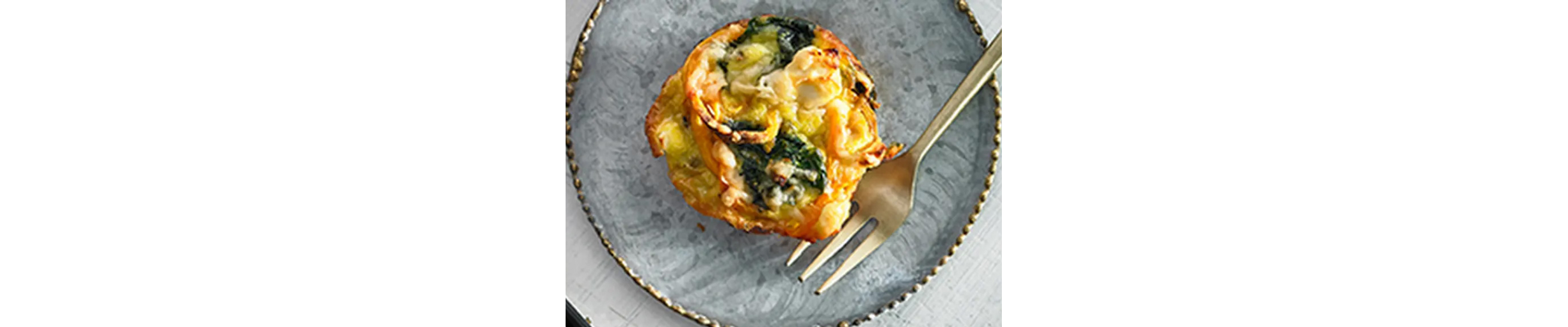 Sweet potato and spinach frittata on blue plate
