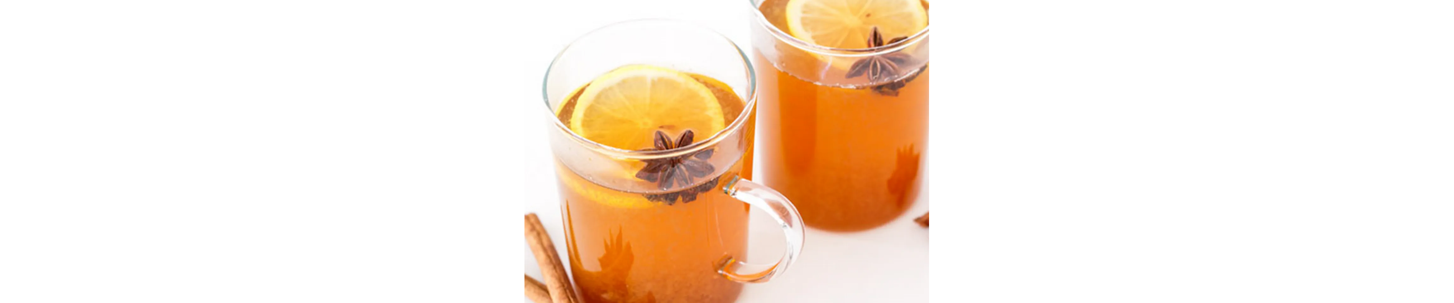 Two mugs of tea with lemon slices