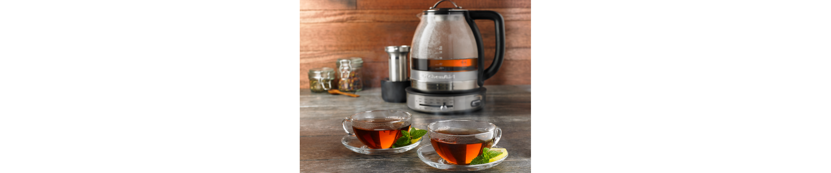 KitchenAid® electric kettle next to a cup of tea