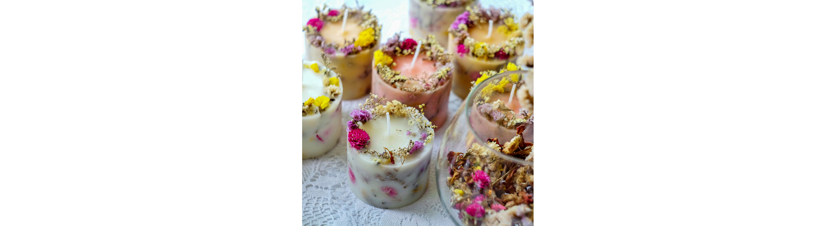 Candles made with flower petals infused into the wax and garnished around the rim of the candle.