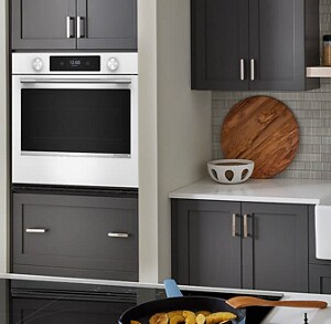 White KitchenAid® dishwasher in a gray and white kitchen