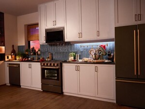 A cozy kitchen with ambient lighting and a range, with its oven light on