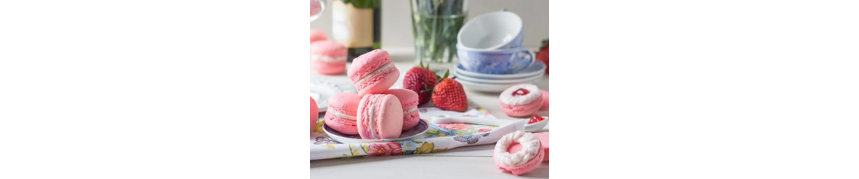 A plate of strawberry rose macarons.