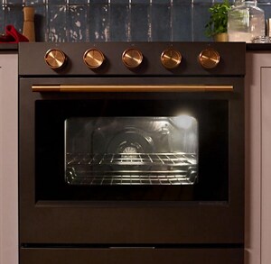 A closeup of the knobs of a KitchenAid® range