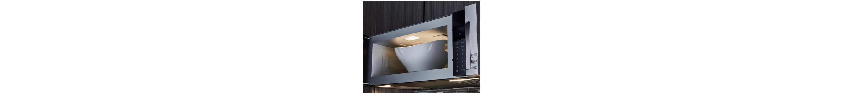 Open microwave with large bowl inside