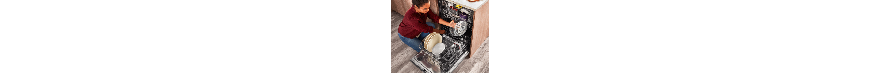 A person loading a dishwasher