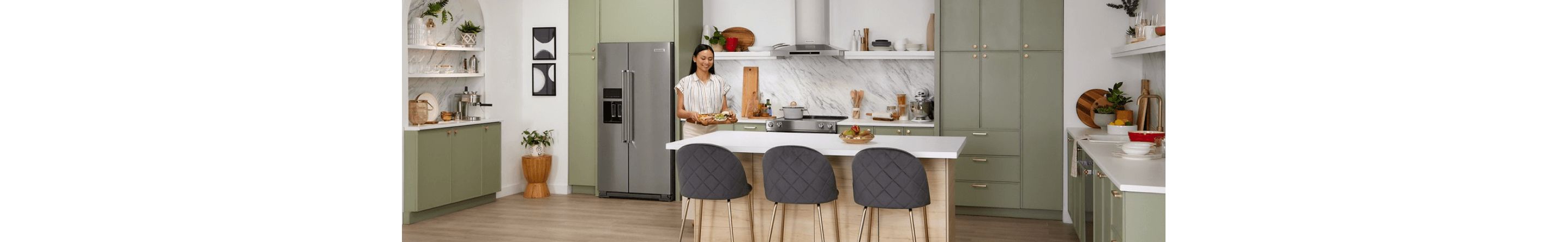 Person setting an hors d'oeuvre platter on a kitchen island