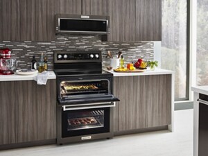 A double oven with baking pans inside