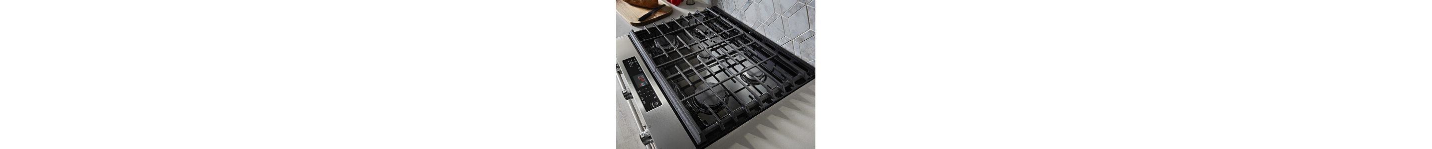 A top view of a stainless steel slide-in range