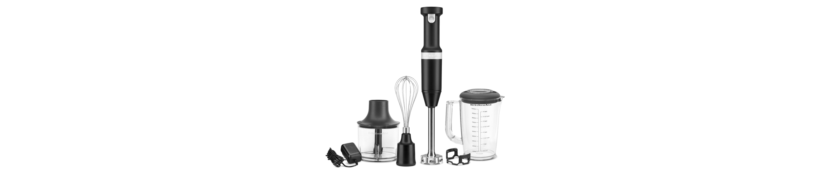 A KitchenAid® cordless hand mixer with whisk attachment.