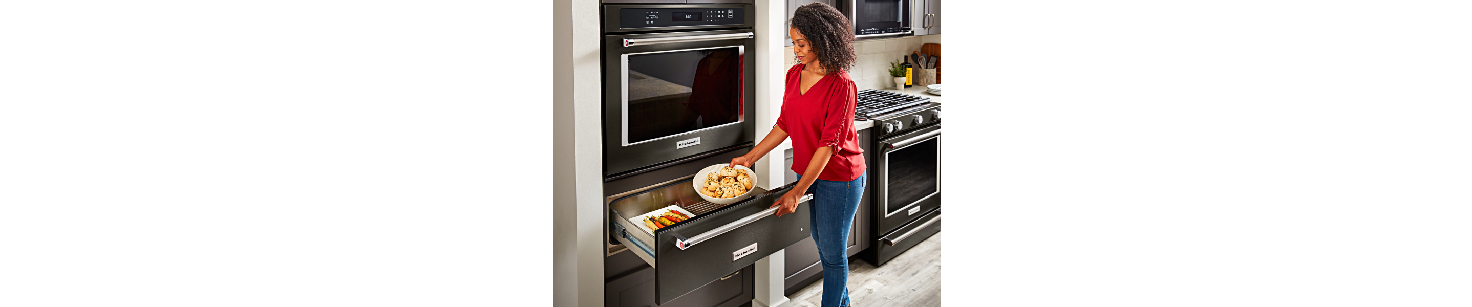 Placing food into a warming drawer 