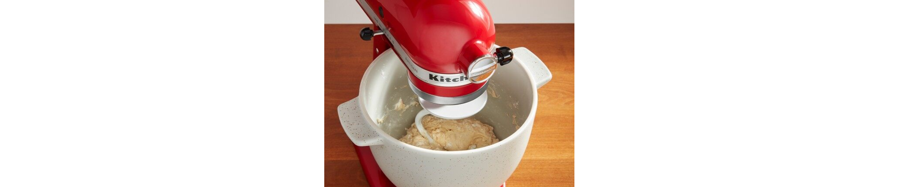Red KitchenAid® stand mixer kneading dough