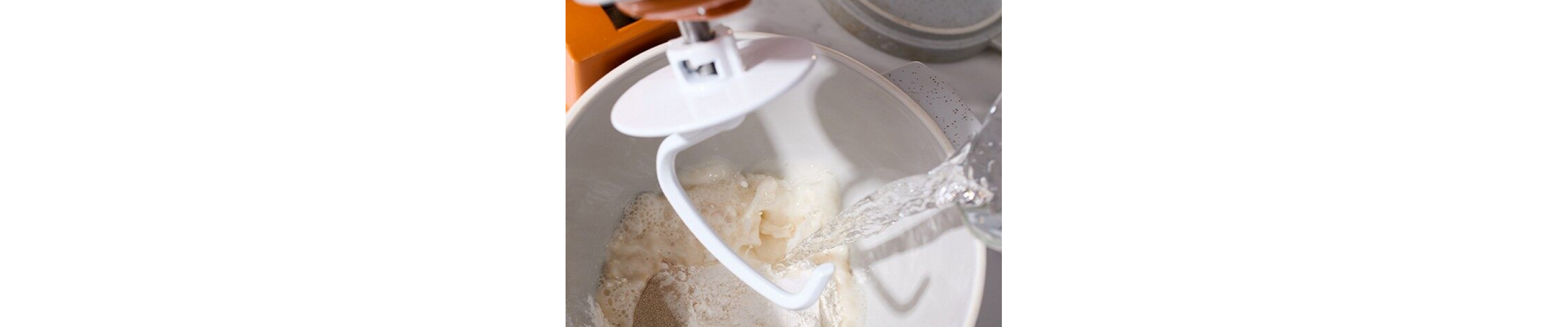 Dough hook in a mixing bowl of dough