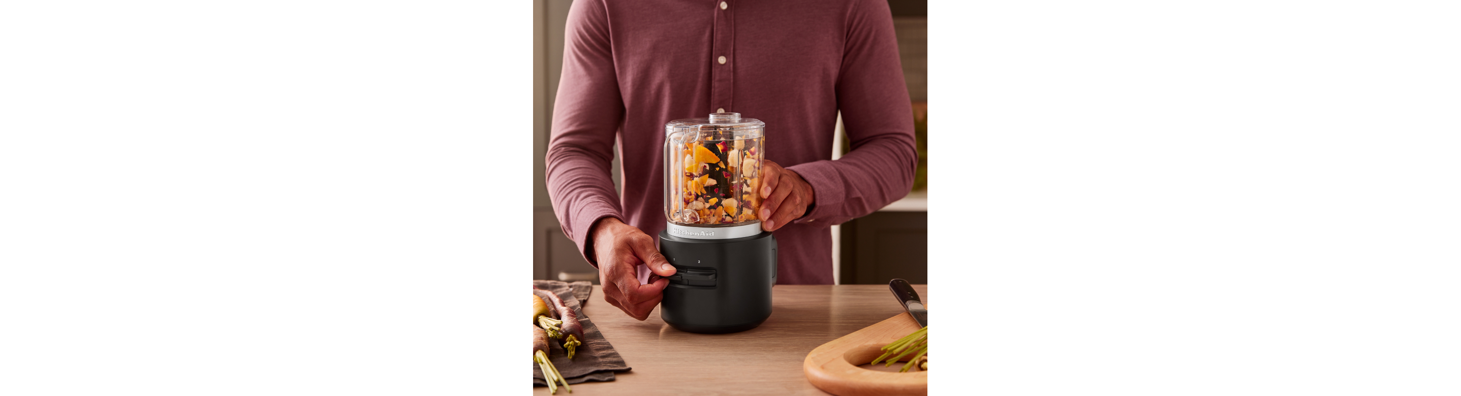 A person using a KitchenAid Go™ Cordless Food Chopper.