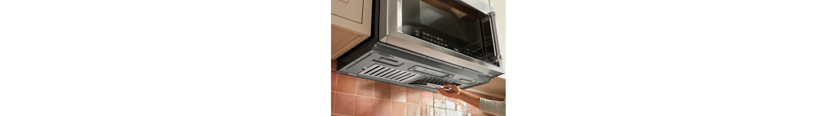 Person installing microwave