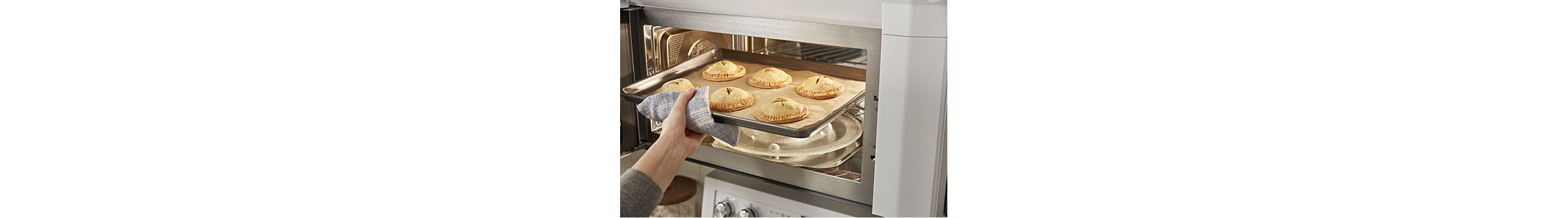 Person removing food from a microwave