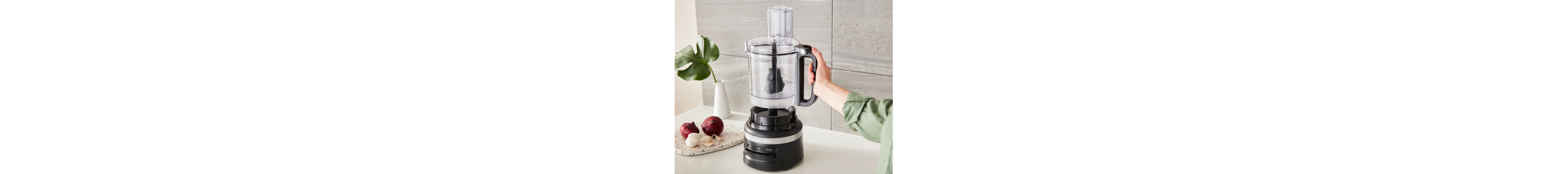 A work bowl being attached to a food processor base