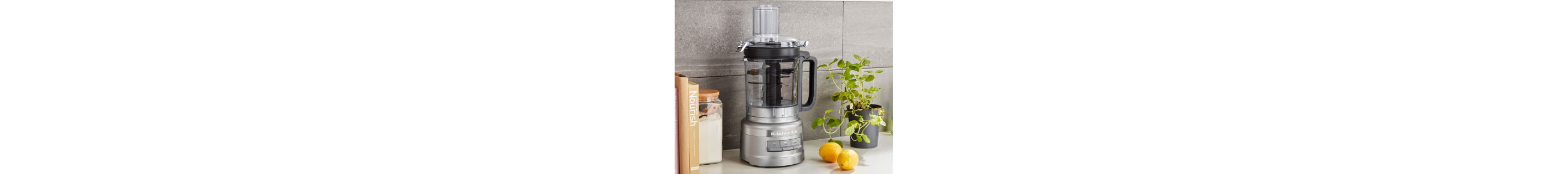 A stainless steel KitchenAid® food processor on a countertop