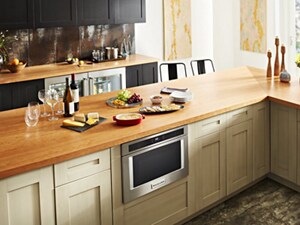 A KitchenAid® Drawer Microwave, surrounded by cabinetry
