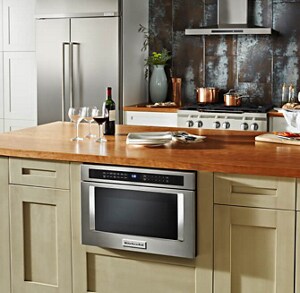 A KitchenAid® Drawer Microwave, surrounded by cabinetry